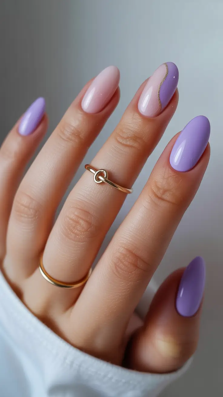 glam spring gel nails 2026 Glossy Lilac Almond with Gold Wave Accent