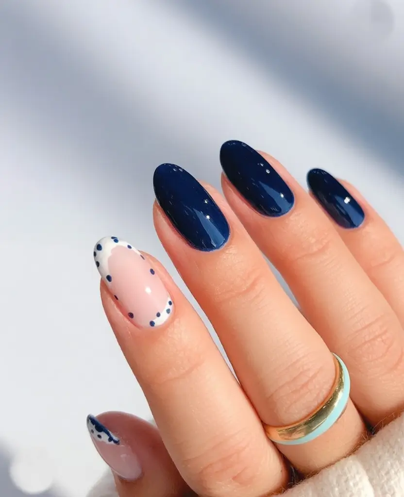 minimalist spring oval nails 2026 Deep Navy Contrast With Minimalist Dot Detailing