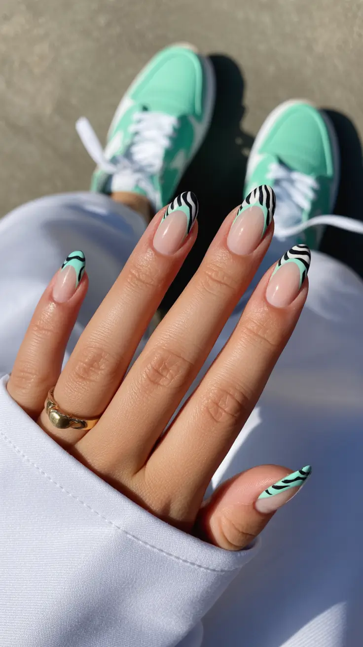 amazing spring almond nails 2026 Mint Zebra Almond Nails With a Graphic Edge