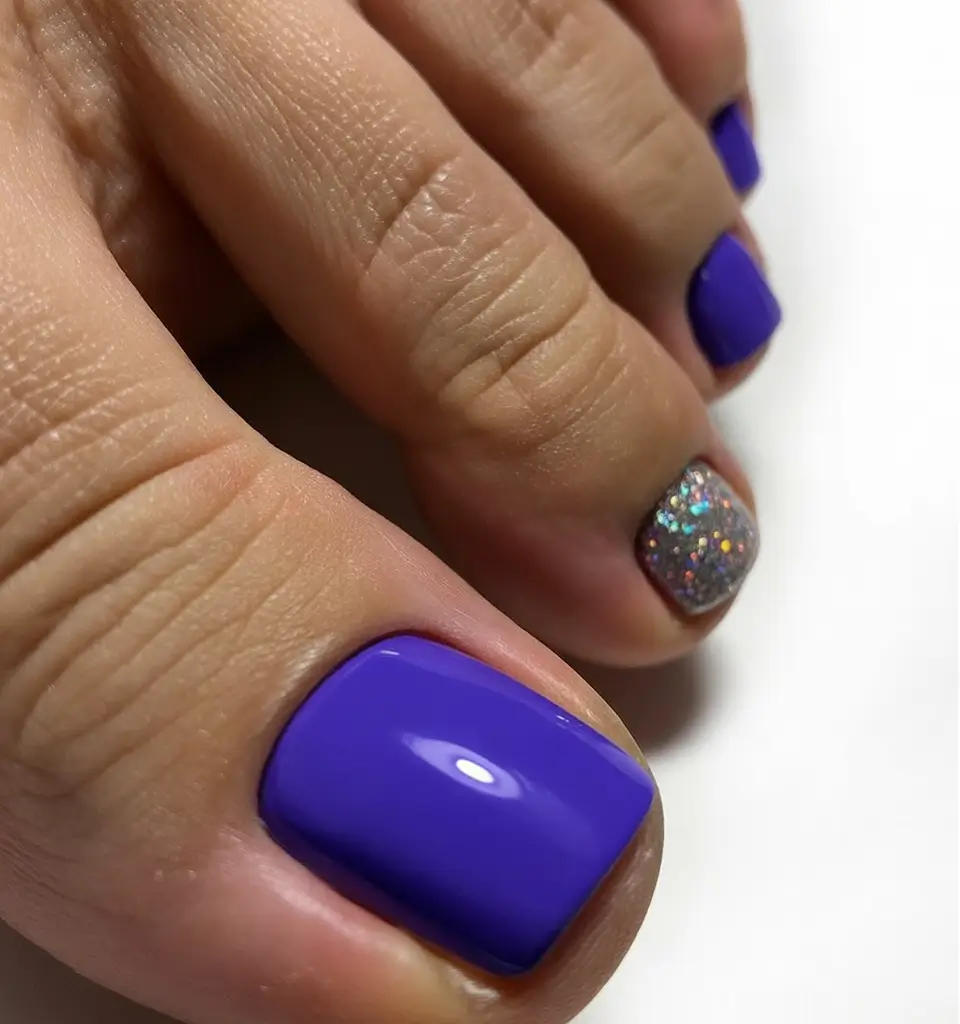 spring toe nails 2026 Deep Violet Pedicure with Glitter Accent