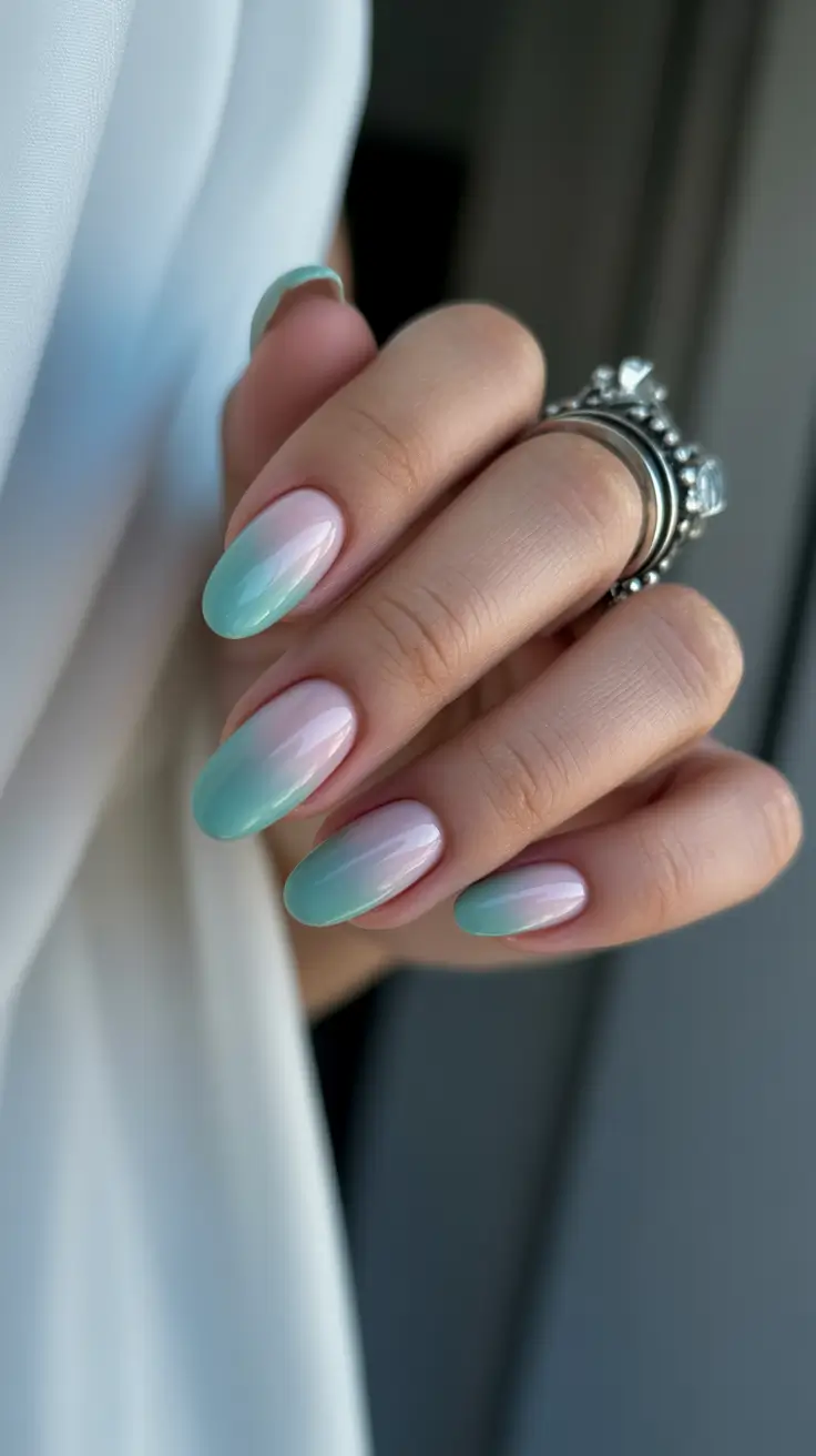 simple spring vacation nails 2026 Soft Blue Ombre Almond Nails for a Calm Beach Mood
