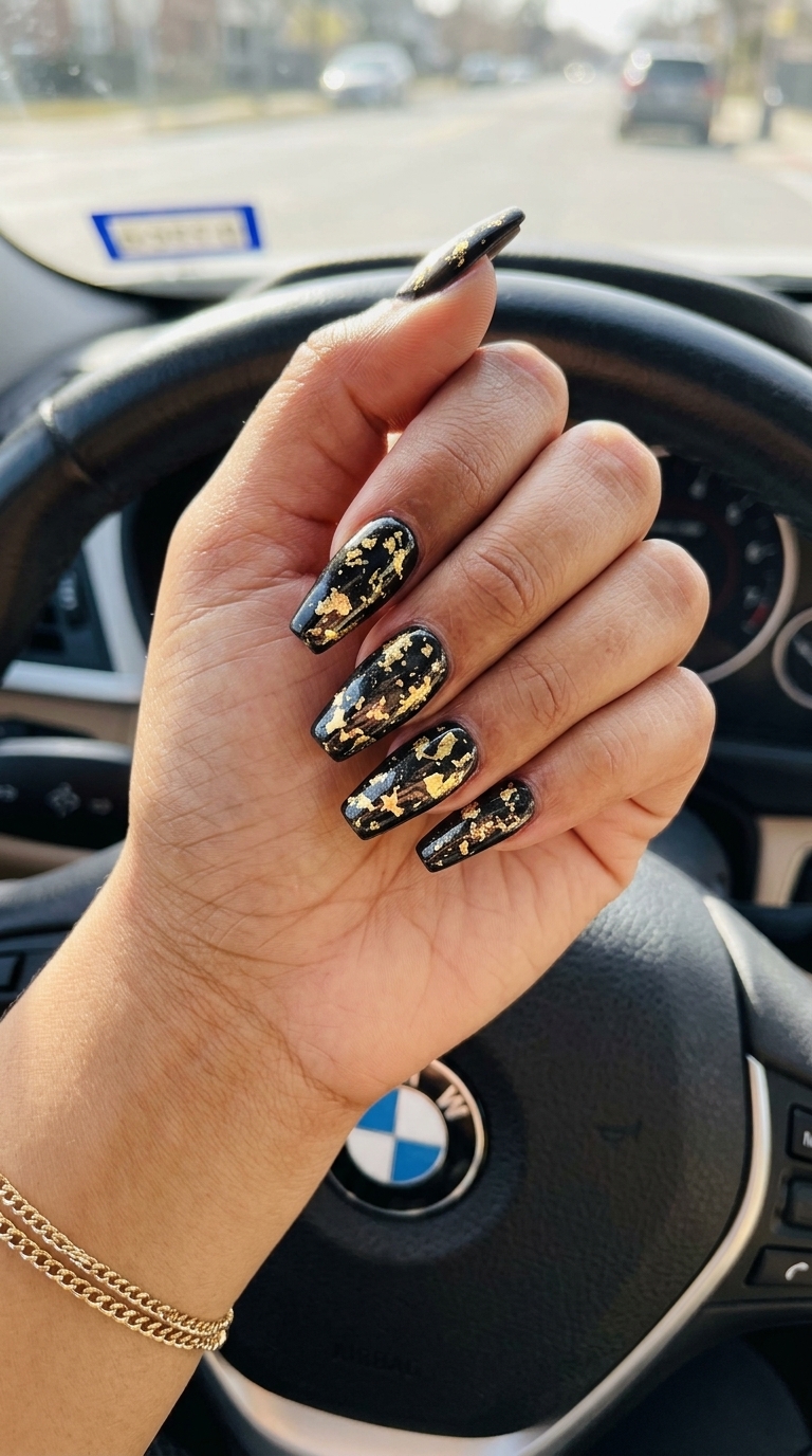 Glamorous black and gold foil nails for a summer night out. Colourful summer nails 2026.