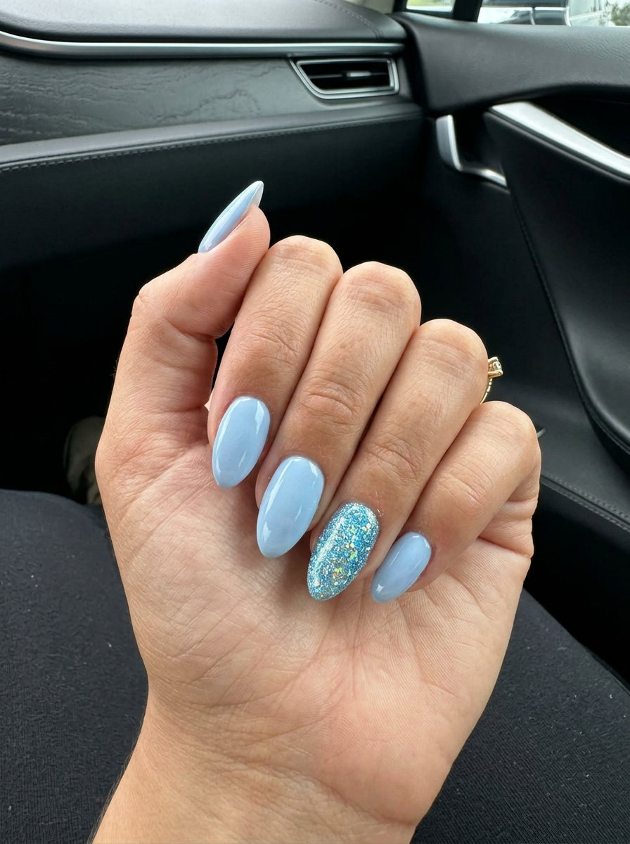 Cute summer nails 2026: Arctic Sparkle Accent with pale blue and icy blue glitter. Fun festival nails.