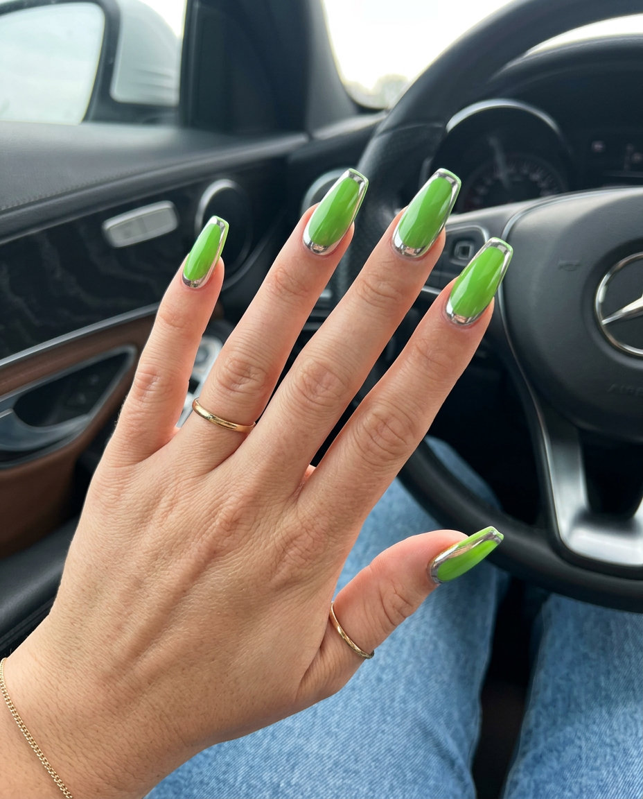 Vibrant lime green nails with silver chrome cuticle accents for futuristic summer 2026 parties.