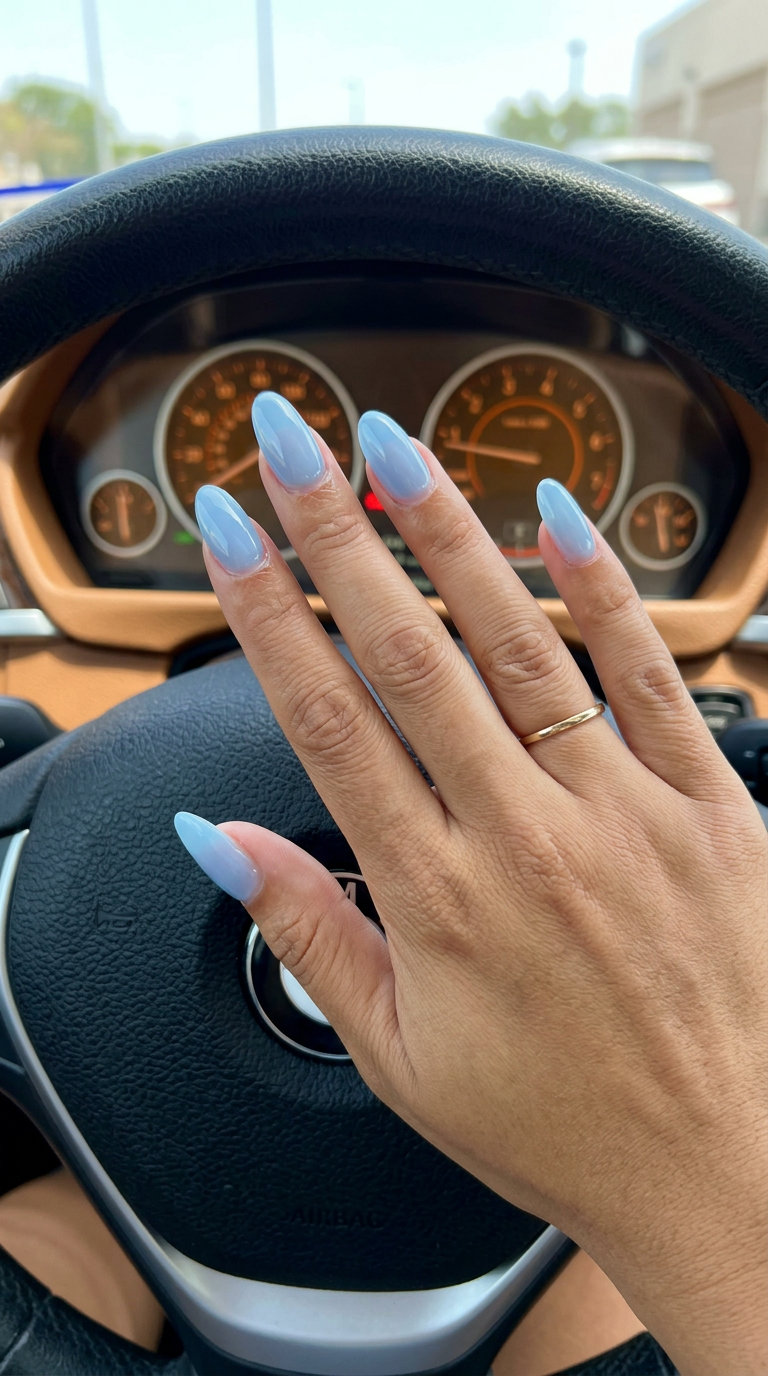 Baby blue jelly oval gloss nails for light summer nails 2026. Chic vacation festival style.