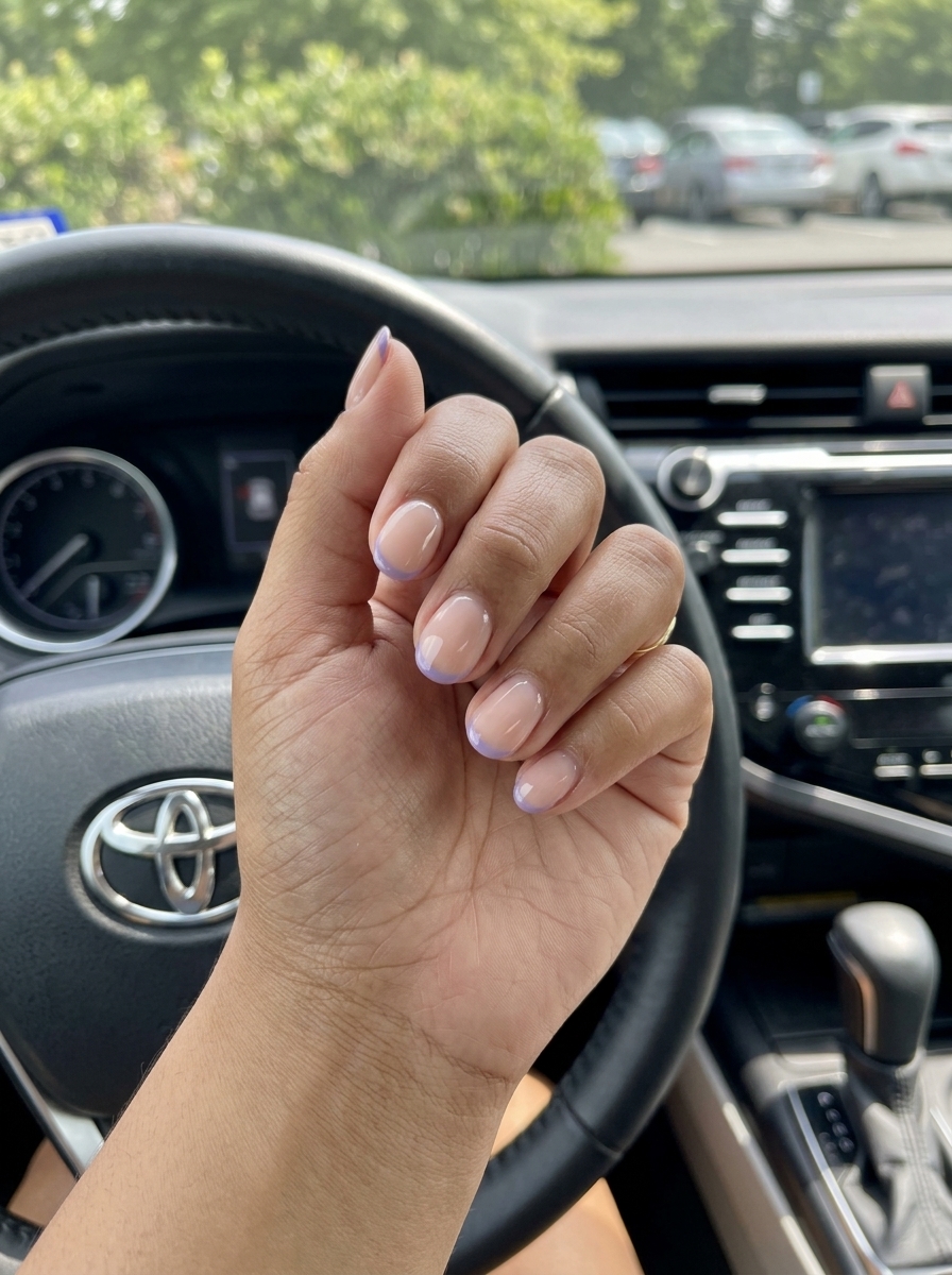 Lavender Micro French Coffin nail designs summer 2026: Sheer nude with soft lavender tips.