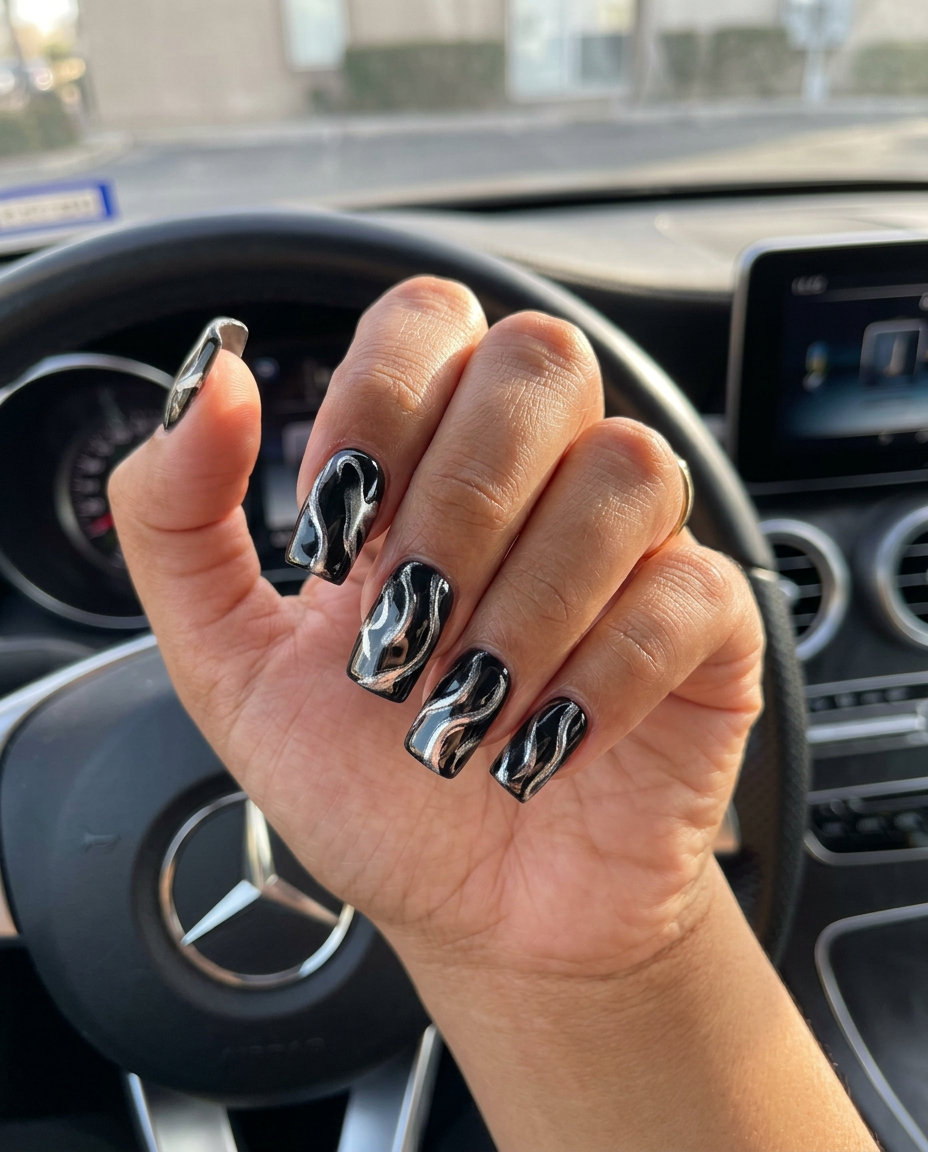 Silver Chrome Swirl Stiletto nail design for edgy summer 2026 party looks.