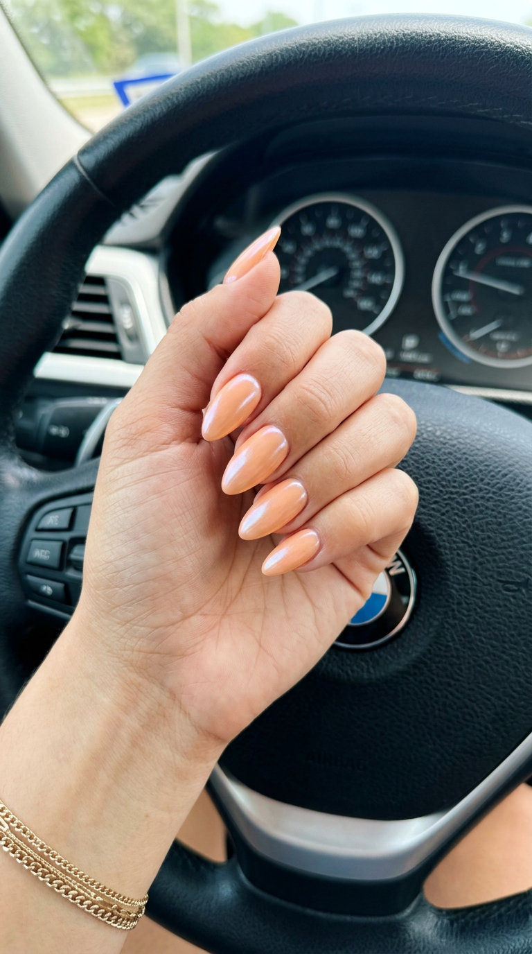 Romantic orange summer nails 2026 with glazed donut shimmer on medium coffin nails. Subtle glamour.