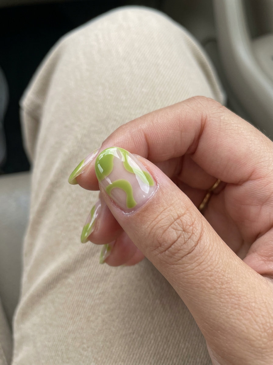 Short oval summer nails 2026: Edgy lime green with negative space for festivals & concerts. Artistic & playful.
