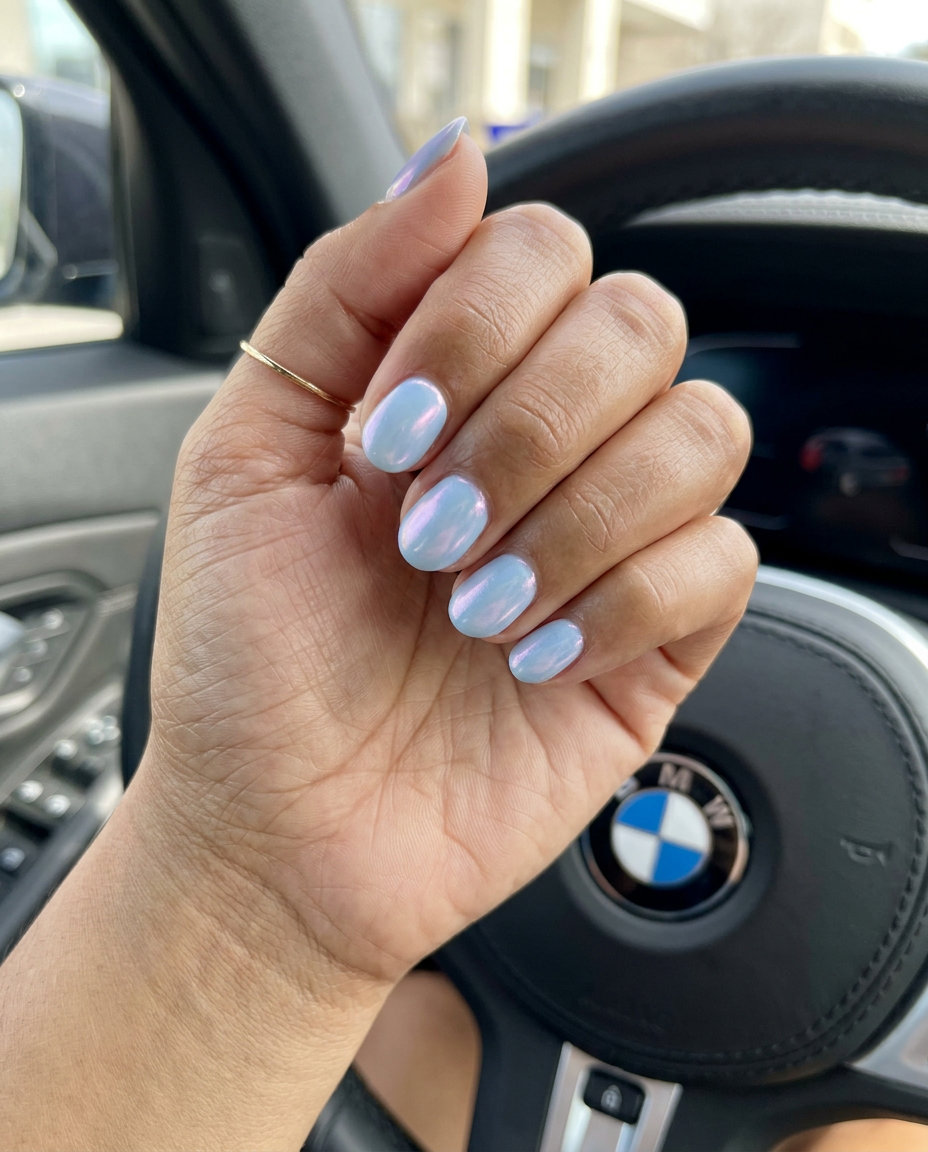 Pale blue pearlescent short oval nails for summer classy nails 2026. Ethereal, romantic style for weddings.