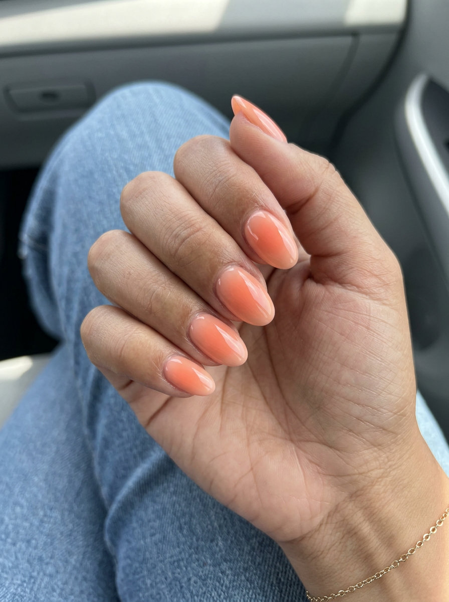 Glowing peach aura nails for summer classy nails 2026. Whimsical, sun-kissed style for vacation.