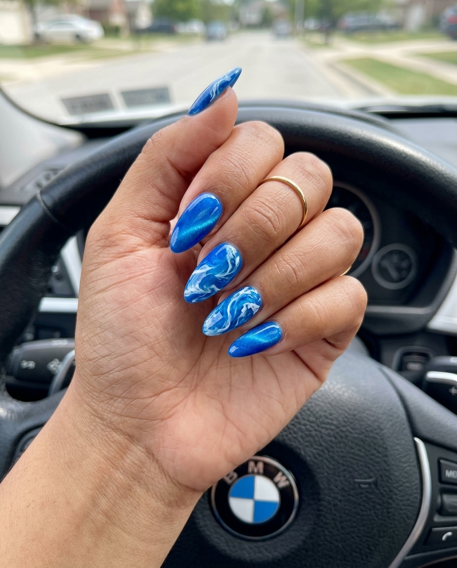 Oceanic abstract swirls short square nails in deep blue and white. Summer dip nails 2026.