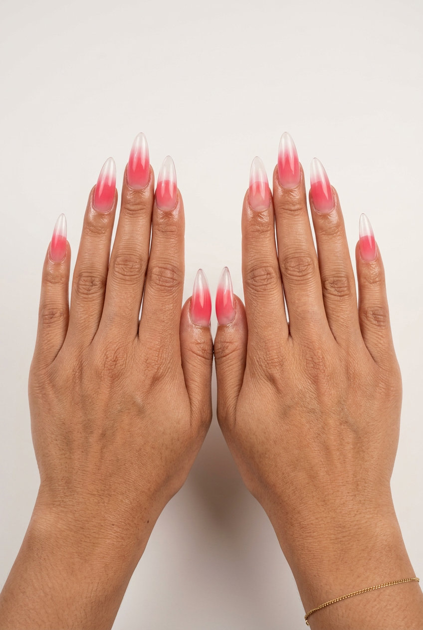 Juicy Ombre Stiletto summer holiday nails 2026: watermelon pink to clear jelly, extra-long stiletto shape.