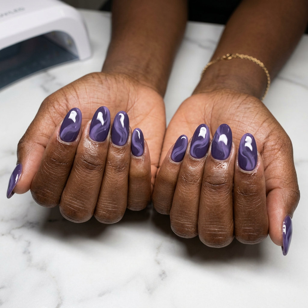 Mystic Swirls Deep Purple Oval: Sophisticated summer nails for dark skin 2026 with lavender swirls.