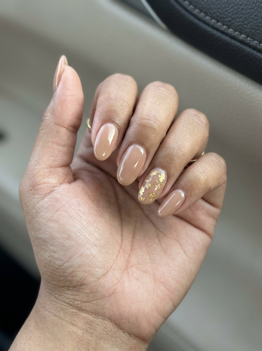 Nude beige nails with gold leaf accent for summer nails one color 2026, perfect for weddings and formal events.
