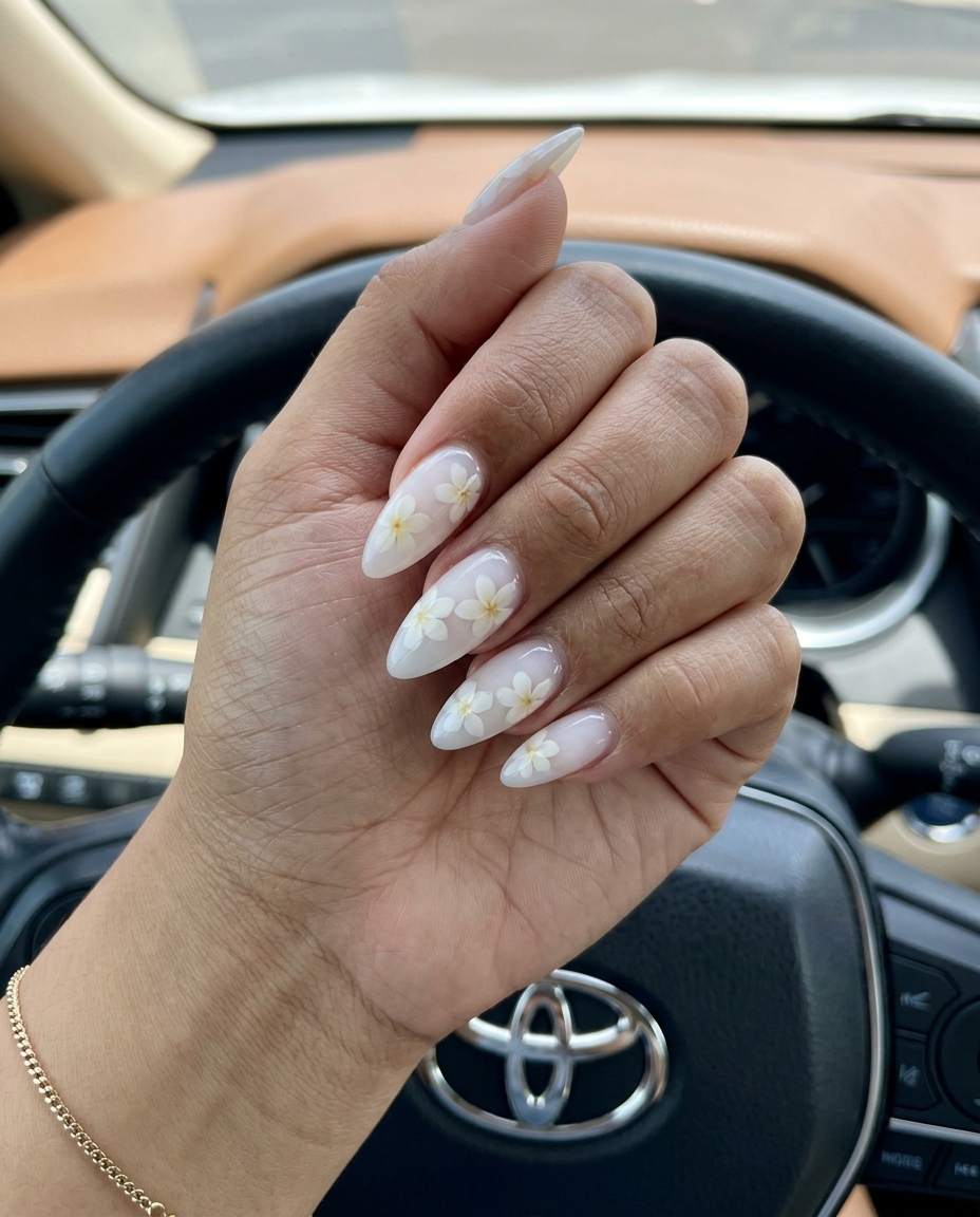 Dreamy plumeria milk bath nails in milky white with delicate white flowers for tropical nail designs 2026.