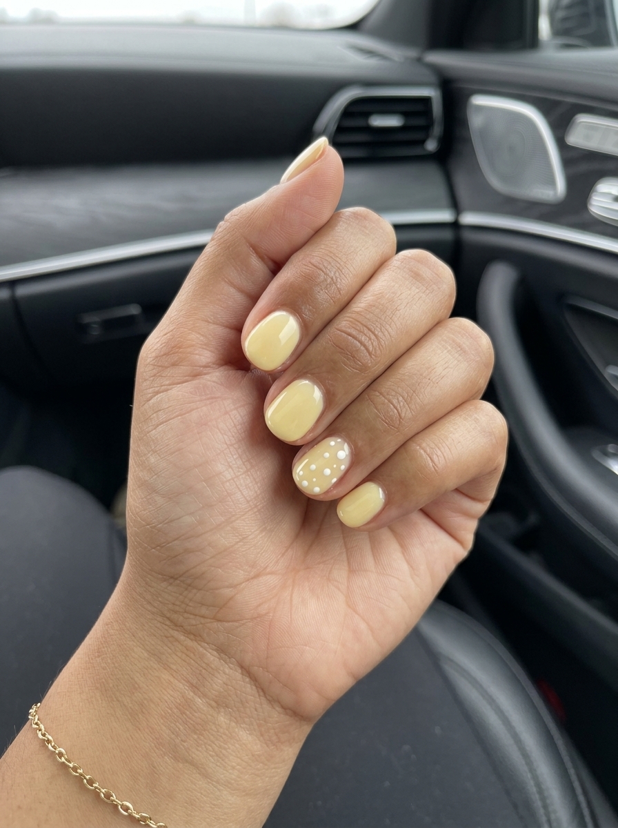 Sunny Dot Accent nails for vacation nails summer 2026. Playful yellow and white dot nails.